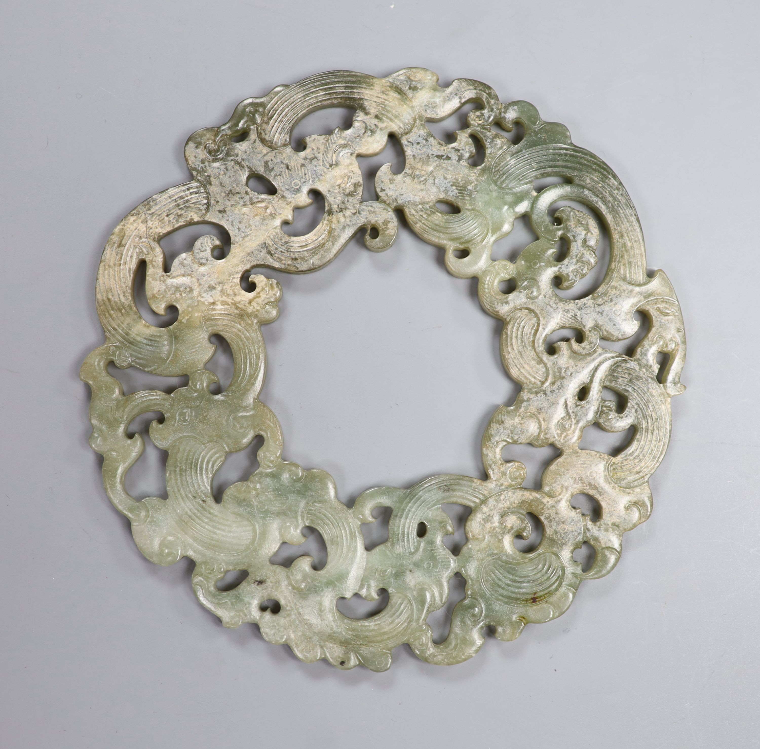 A Chinese archaistic celadon jade disc, D. 23.2cm